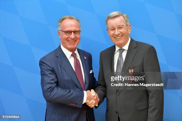 Karl-Heinz Rummenigge and Karl Hopfner, CFO of FC Bayern Muenchen, during Karl Hopfner Is Awarded With The Federal Cross of Merit at department of...
