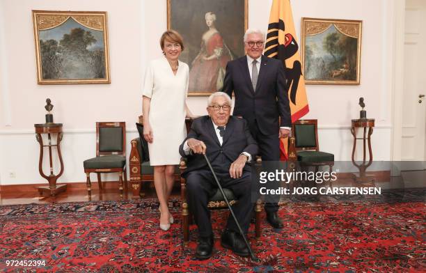 German President Frank-Walter Steinmeier , his wife Elke Buedenbender and Henry Kissinger pose for photographers at the presidential Bellevue Palace...