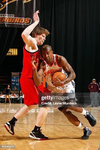 Carlos Powell of the Albuquerque Thunderbirds moves the ball against Coby Karl of the Idaho Stampede during the NBA D-League game on January 23, 2010...