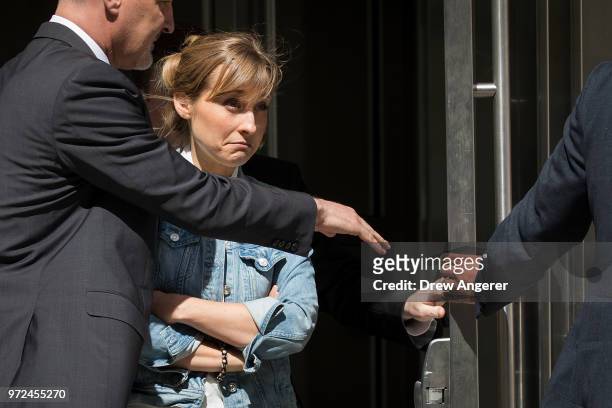 Actress Allison Mack exits the U.S. District Court for the Eastern District of New York following a status conference, June 12, 2018 in the Brooklyn...