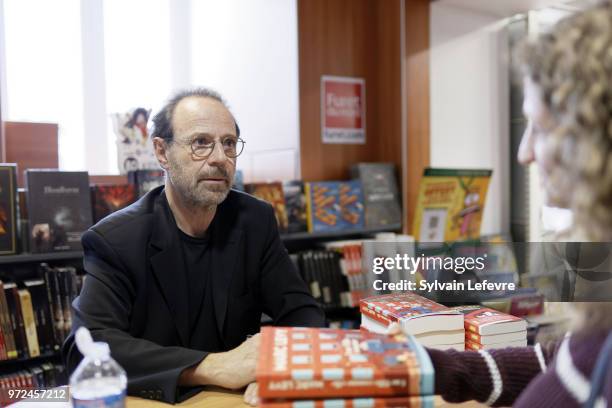 French writer Marc Levy attends a book signing at Furet du Nord on June 12, 2018 in Lille, France.