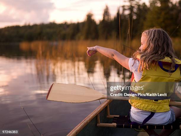 girl in a canoe - lake of the woods stock pictures, royalty-free photos & images