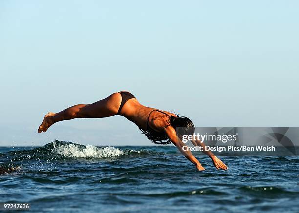 woman diving in the ocean - southern european descent bildbanksfoton och bilder