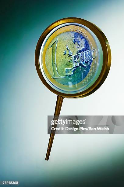 magnifying glass with euro - loonie stock pictures, royalty-free photos & images