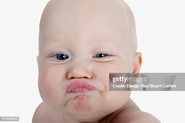 baby making a funny face - baby face stock pictures, royalty-free photos & images