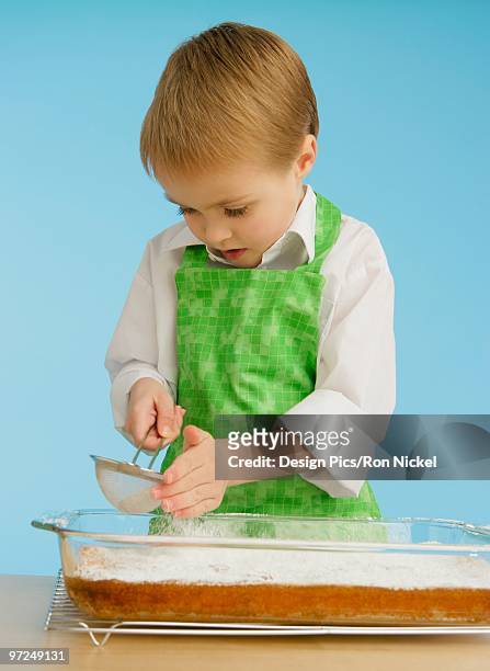 boy baking - powdered sugar sifter fotografías e imágenes de stock