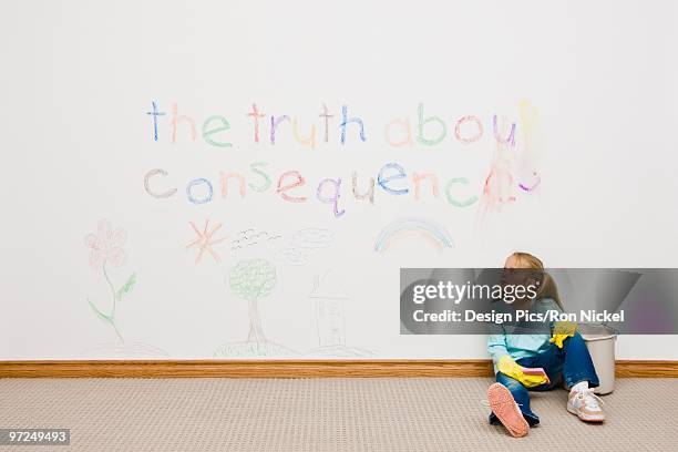 girl cleaning writing on the wall - scouring stock pictures, royalty-free photos & images