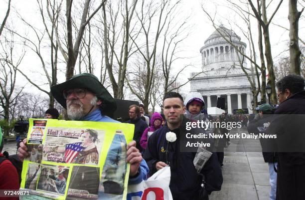 Anti-war protesters participate in a mock funeral procession for victims of the war in Iraq this morning. The march, which began at Grant's Tomb in...