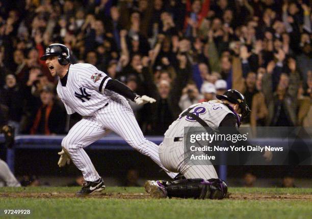 Arizona Diamondbacks' catcher Rod Barajas can't hang to the ball as Chuck Knoblauch scores the winning run in the twelfth inning of Game 5 of the...