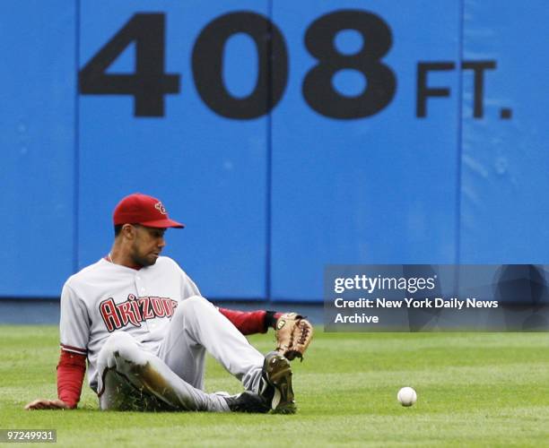 Arizona Diamondbacks' center fielder Chris Young misses a sliding catch for a single that scored a run in the seventh inning of a game against the...