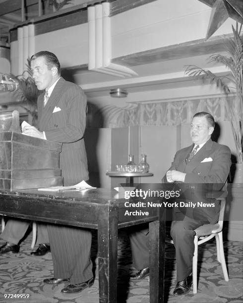 At Hotel Astor Air Raid wardens meeting are Ed Sullivan, alternate zone warden and seated in rear is Robert Christenberry, General Manager of the...