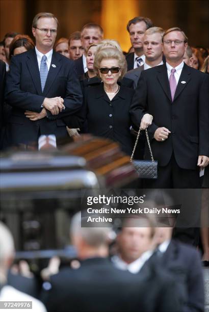 Ann Mara, flanked by two of her sons, leaves St. Patrick's Cathedral after funeral services for her husband, New York Giants' owner Wellington Mara....