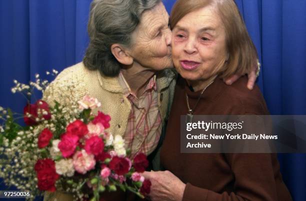 Anna Kopec kisses Sally Krueger at Kennedy Airport after arriving on a flight from Poland. The two hadn't seen each other in almost 60 years since...