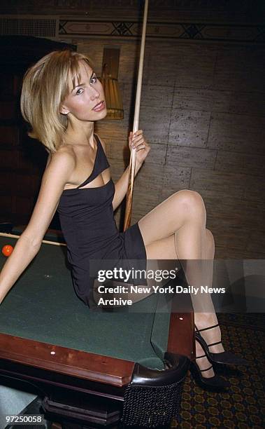 Anna Malova, Miss Russia 1998, poses on a pool table at The Campbell Apartment restaurant in Grand Central Station. She makes her motion picture...