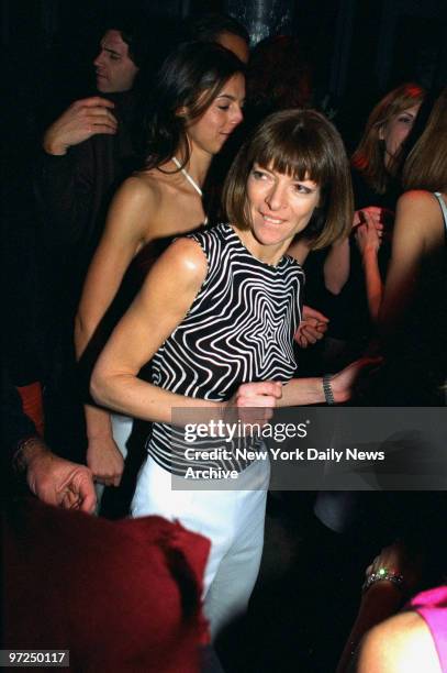 Anna Wintour dances at a party at Nell's, where she was hosting a party to celebrate the publication of Vogue's April issue, featuring a photo of...