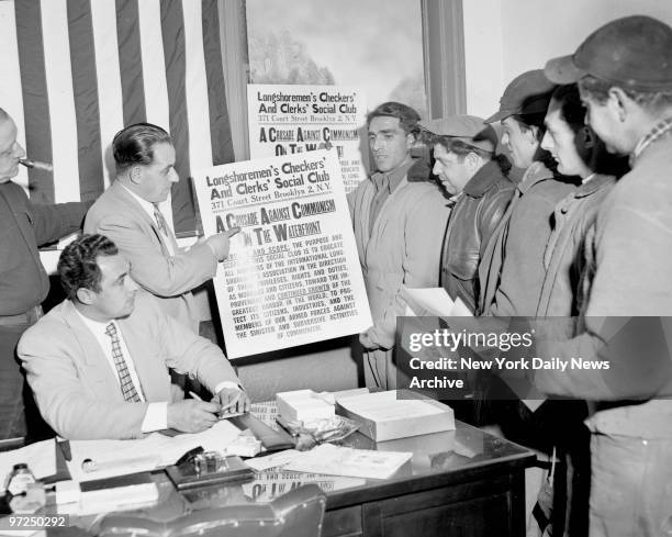 Anthony Anastasia explains his "crusade" against communisum to longshoremen at 371 Court St., Brooklyn, as Peter Incorvaia waits to enlist them.