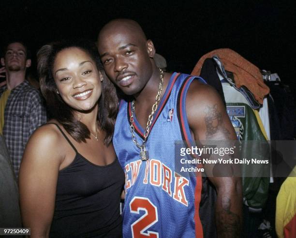Arnelle Simpson gets together with rapper Treach backstage at the Vibe magazine Seminar Fashion Show at the Waldorf-Astoria. Simpson, a stylist, was...
