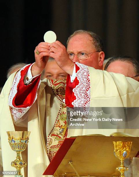 Archbishop conducts the communion during the ceremonial Mass where Archbishop Timothy Dolan was installed as spiritual leader of 2.5 million New York...