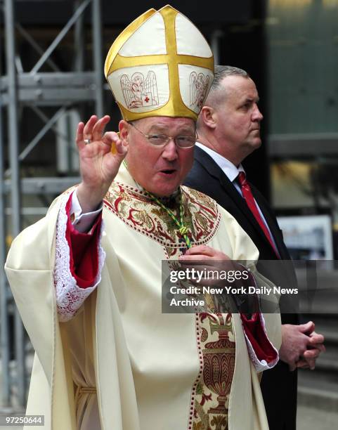 Archbishop Timothy Dolan gives OK sign at ordination procession Mass at St. Patrick's Cathedral.