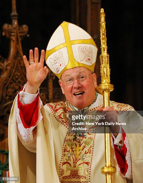 Archbishop Timothy Dolan grins with his hands holding the Holy scepter during the ceremonial Mass where Archbishop Timothy Dolan was installed as...