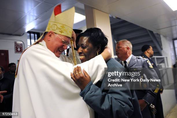 Archbishop Timothy M. Dolan greets the inmates during his visit to the Bedford Hills Correctional Facility