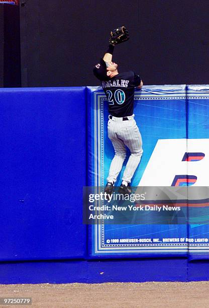 Arizona Diamondbacks' Luis Gonzalez watches homer hit by New York Mets' Edgardo Alfonzo go over the fence in fourth inning of Game 4 of the National...