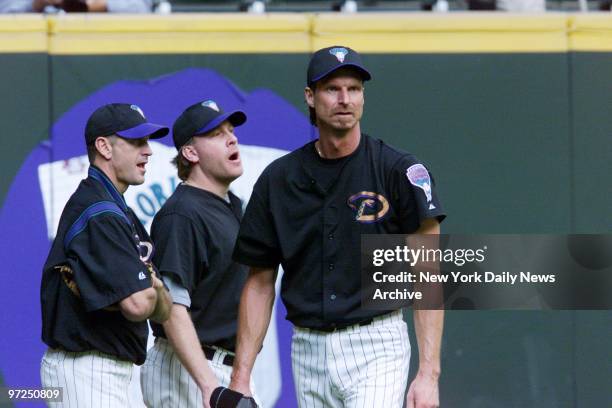 Arizona Diamondbacks' pitchers Curt Schilling and Randy Johnson practice at Bank One Ballpark in Phoenix, Ariz., on the day before their team takes...