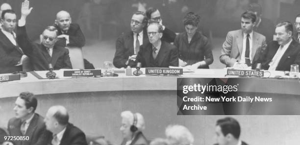 Arkady Sobolev raises his hand to veto resolution by Henry Cabot Lodge Jr., with Britain's Sir Pierson Dixon seated between them.