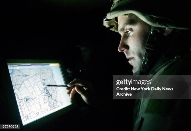 Army Lt. Matt Caldwell of Staten Island, N.Y., checks his Humvee?s position during a night patrol in Baqubah, Iraq, with his platoon of the 3rd...