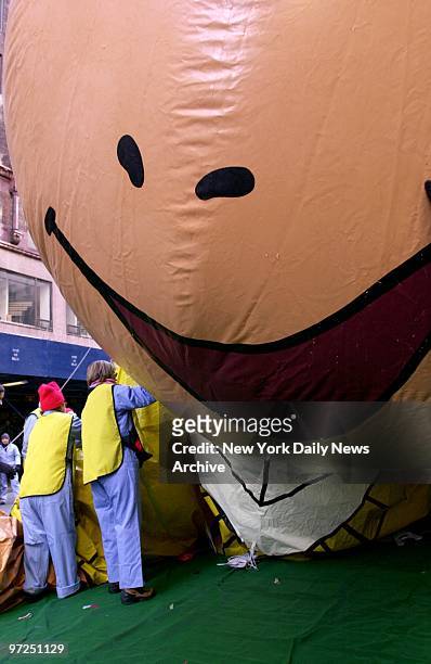 Arthur the Aardvark is deflated along with all the other balloons after the 74th annual Macy's Thanksgiving Day Parade.