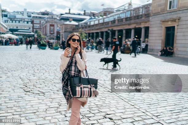 businesswoman in london talking on phone - well dressed stock pictures, royalty-free photos & images
