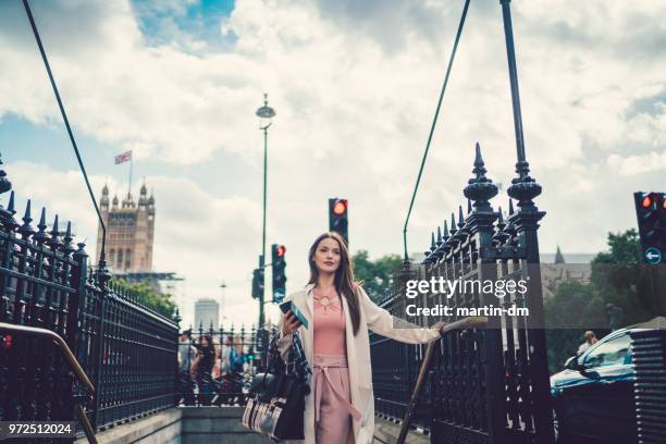 businesswoman exiting the london subway - navigational equipment stock pictures, royalty-free photos & images