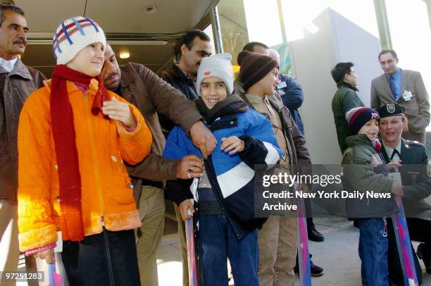 As Army Staff Sgt. Marikay Satryano looks on, Ashajan Jarallah Asaid Sibreal Sabre Wsam Rabea Abo Senda and Sivar Hawar all from Iraq, leave...