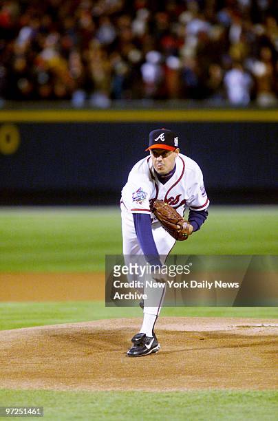 Atlanta Braves' starting pitcher Greg Maddux pitches in the first inning of Game 1 of the World Series against the Atlanta Braves at Turner Field.