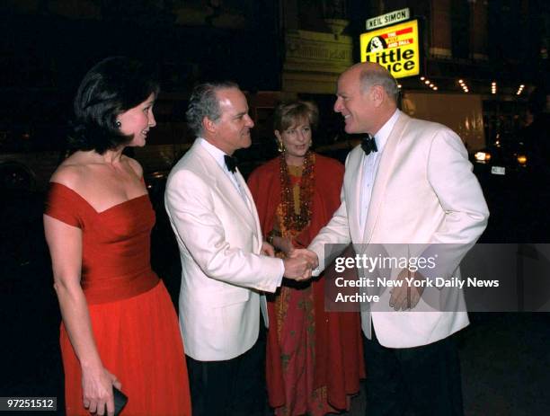 Barry Diller greets Henry Kravis and his wife Marie-Jose at Edgar Bronfman reception at Roseland.