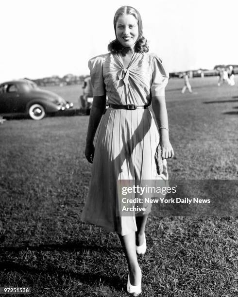 Edith Beale models newest item in horse-show styles, bandana and all. Miss Beale shown at annual East Hampton Horse Show, is daugther of Mrs. Phelan...