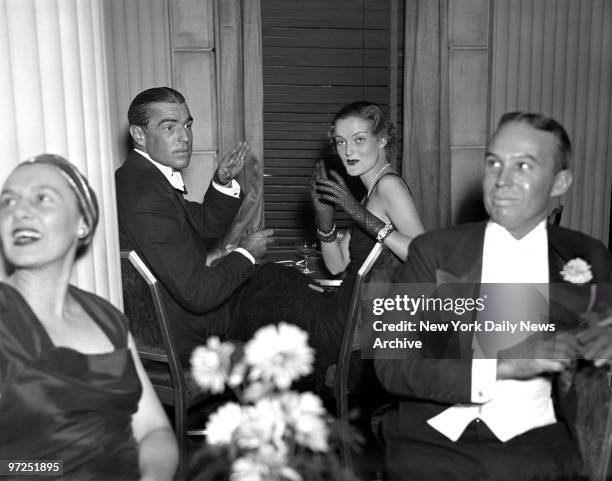 Ixnay," say M. Dorland Doyle and Doris Duke, tobacco heiress, making frantic wig-wag signals at photographer, but all in vain. "Click" went camera's...