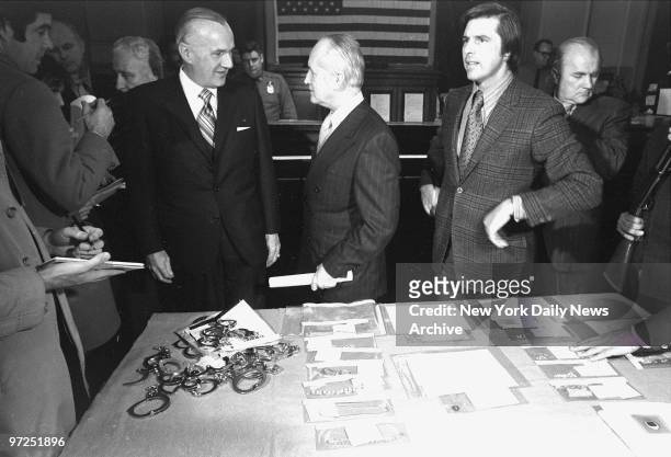 At E. 67th St. Station house, FBI New York director John Malone, Police Commissioner Murphy and Robert Daley, deputy commissioner for police public...