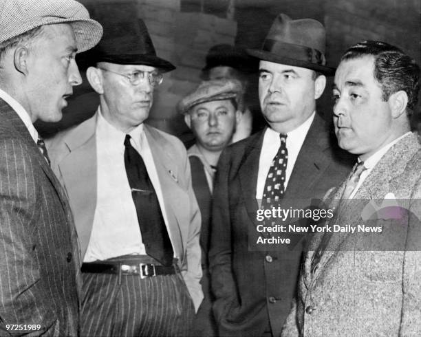 At Saratoga train station, Bing Crosby, Damon Runyon, Attorney James Noonan and John Montague. Montague is on his way to face robbery charges.