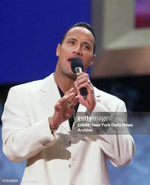Dwayne "The Rock" Johnson, the World Wrestling Federation champion, practices calling the delegates to order during the third night of the Republican...