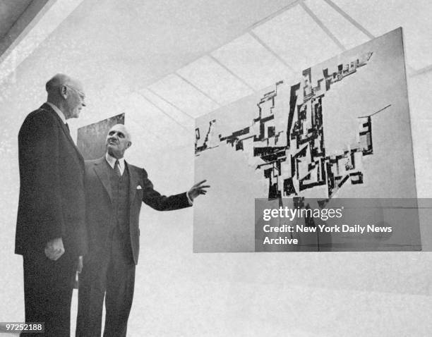 Earl Castle Stewart and Harry Guggenheim look at art work at the opening of the Solomon R. Guggenheim Museum.