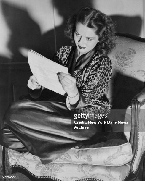 At the Waldorf Astoria, actress Arleen Whelan reads over her script for a radio broadcast.