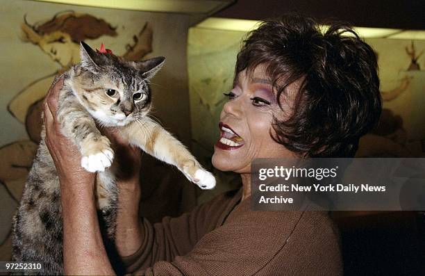 Eartha Kitt with cat named Confetti at the Carlye Hotel where she was doing a charity promotion for the ASPCA.