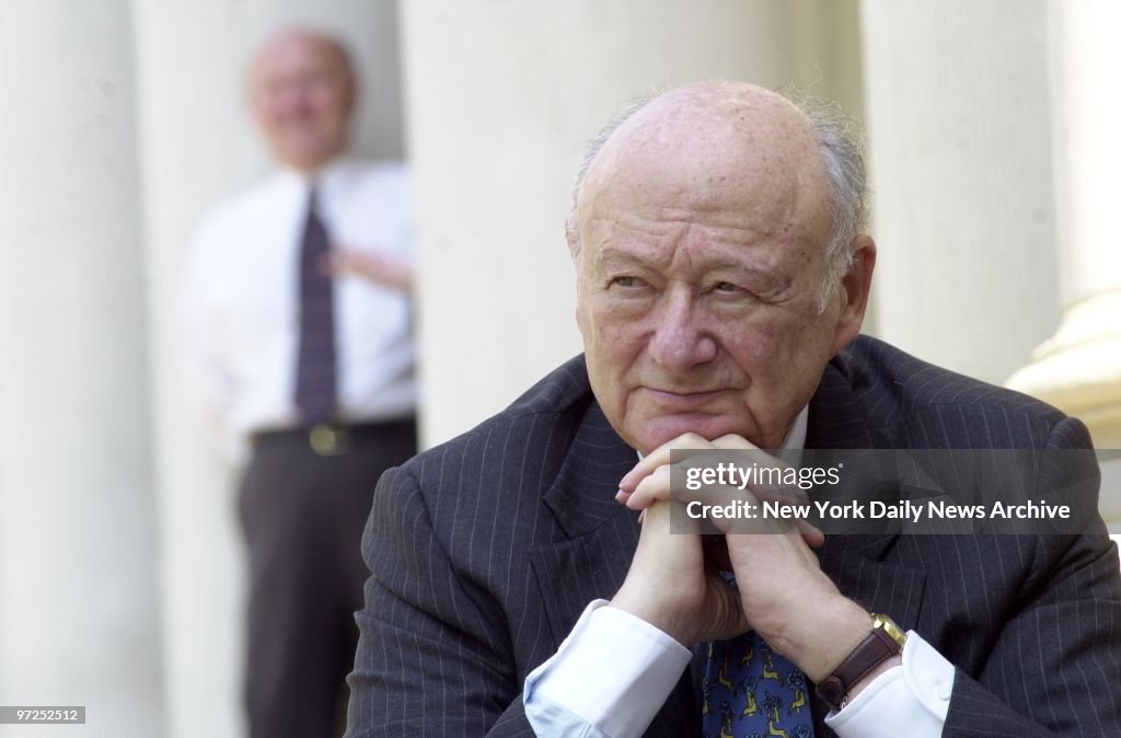 Ed Koch is in a contemplative mood as he sits on the steps o