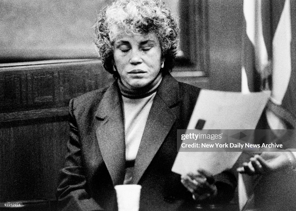 Hedda Nussbaum cries in court as she identifies a photo of L