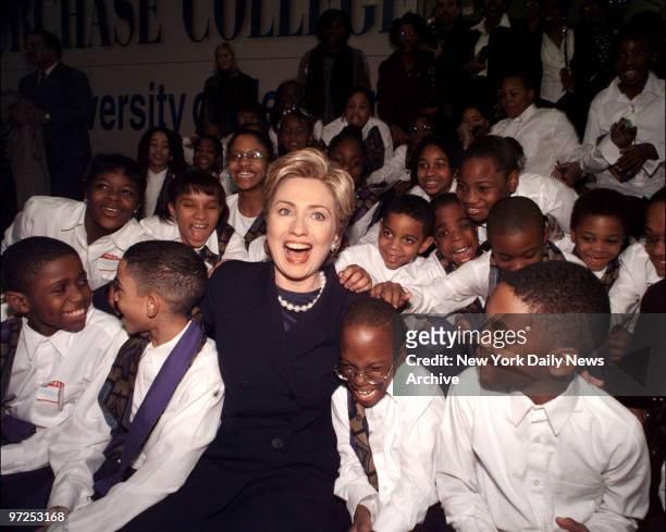 Hillary Rodham Clinton joins youngsters from the Hanifah Children's Choir of Brooklyn at SUNY Purchase, where she officially launched her run for the...