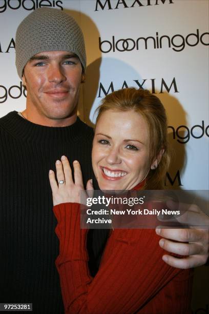 Bachelorette Trista Rehn and fiance Ryan Sutter cuddle at Bloomingdale's, where she hosted a Maxim magazine promo to launch the Maxim Ultimate...