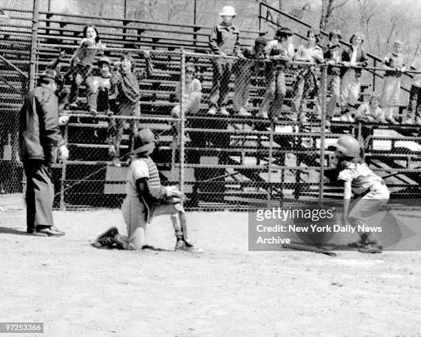 Bitsy Osder , aged 9, the first girl to play Little League baseball in New Jersey, slams down her bat after whiffing her first time up in the first...