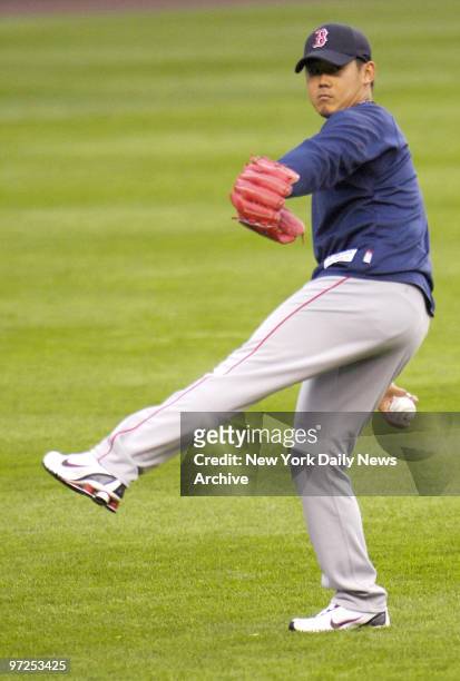 Boston Red Sox's starting pitcher Daisuke Matsuzaka warms up before a game against the New York Yankees at Yankee Stadium in the Bronx.