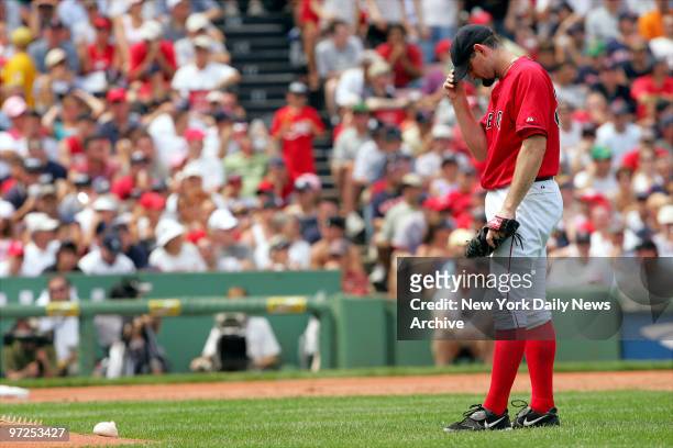 Boston Red Sox's starting pitcher Matt Clement reacts after giving up an RBI single to New York Yankees' Bernie Williams in the third inning of game...